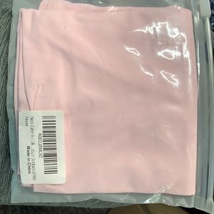 Light pink neck gaiter still in packing never used